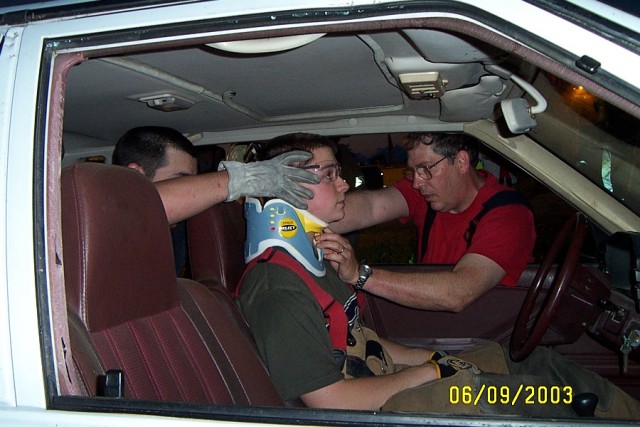 Ambulance personnel Dean Dreibelbis and Charles Foy, Jr. practice neck stablization on Kevin Sweeny